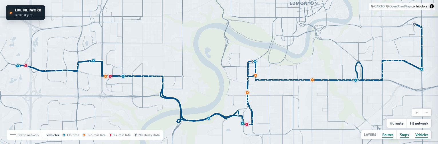 Map close-up: custom basemap, a selected route and delay-coloured vehicles with heading markers
